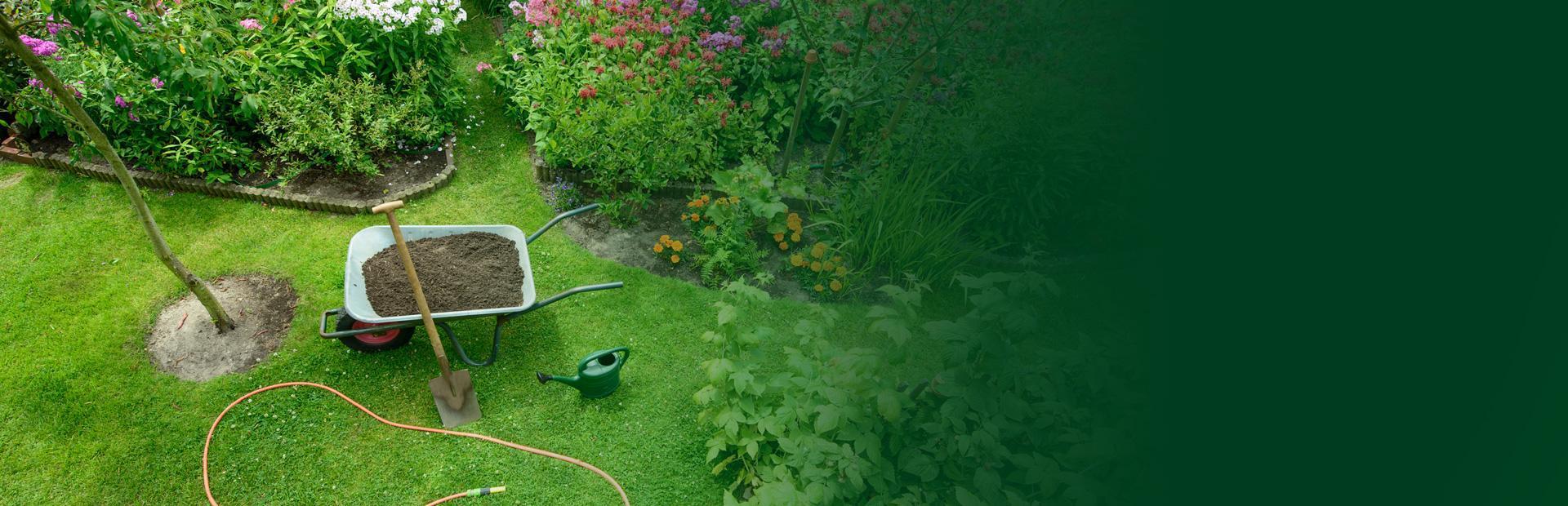 Piękny ogród z taczką i narzędziami ogrodowymi firma Art-Eco - slide 1